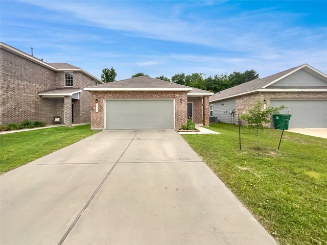 single story home with a garage and a front lawn