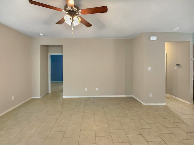 empty room featuring ceiling fan and light tile floors