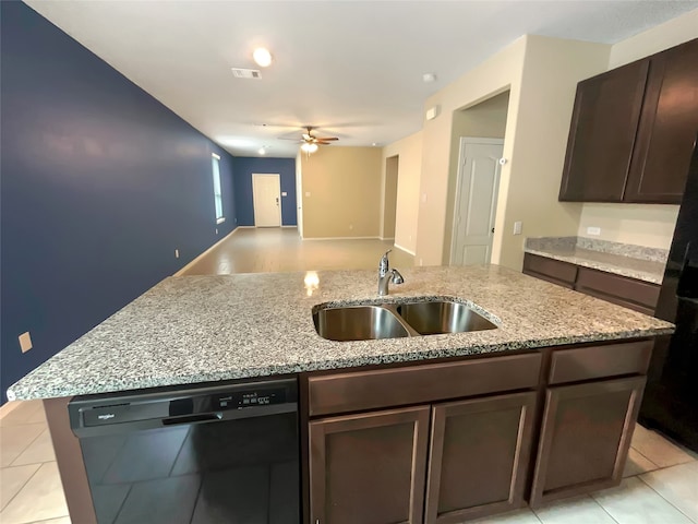 kitchen with light stone counters, ceiling fan, sink, dishwasher, and dark brown cabinets