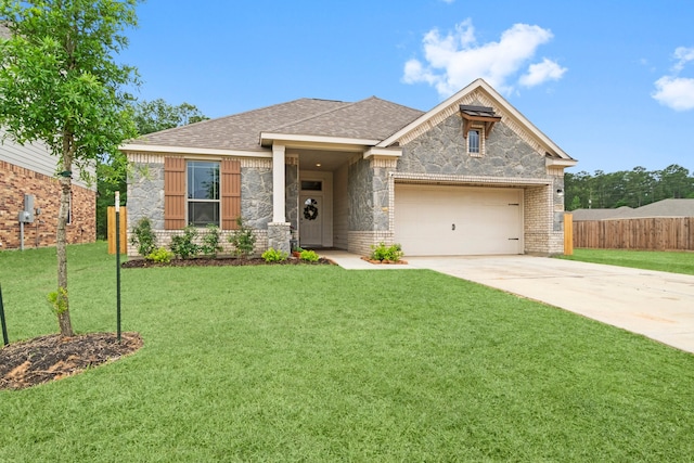 view of front of house with a garage and a front yard