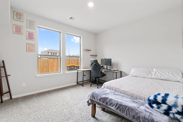 bedroom with light colored carpet