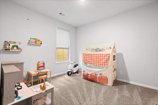 playroom with dark colored carpet