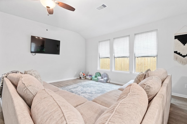 bedroom featuring dark hardwood / wood-style flooring, ceiling fan, and vaulted ceiling