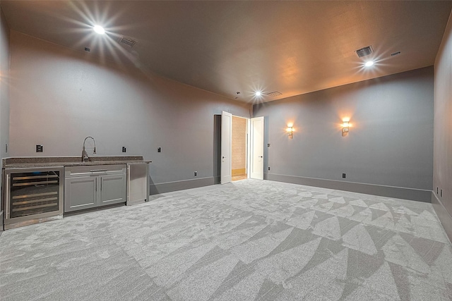 interior space featuring indoor wet bar and beverage cooler