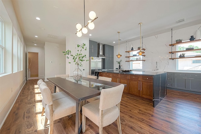 dining area with dark wood-type flooring and sink