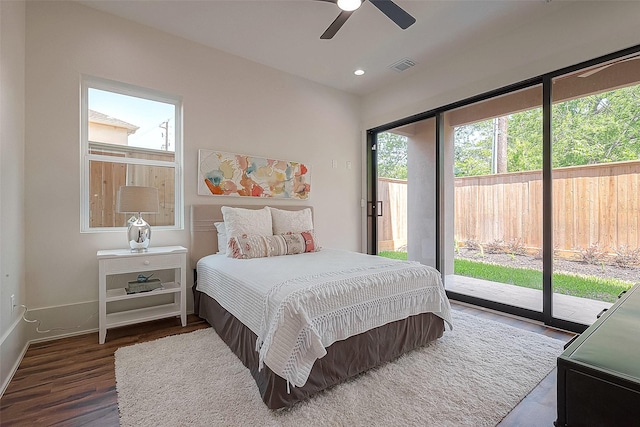 bedroom with ceiling fan, dark hardwood / wood-style flooring, and access to outside