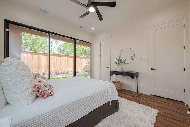 bedroom featuring access to outside, ceiling fan, and dark hardwood / wood-style floors