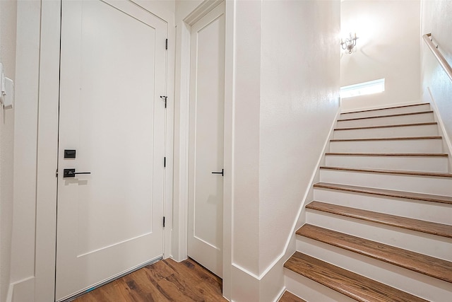 stairway featuring hardwood / wood-style floors