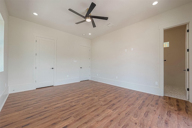 unfurnished room featuring hardwood / wood-style floors and ceiling fan