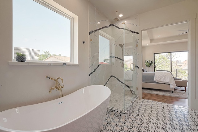 bathroom featuring tile patterned floors and independent shower and bath