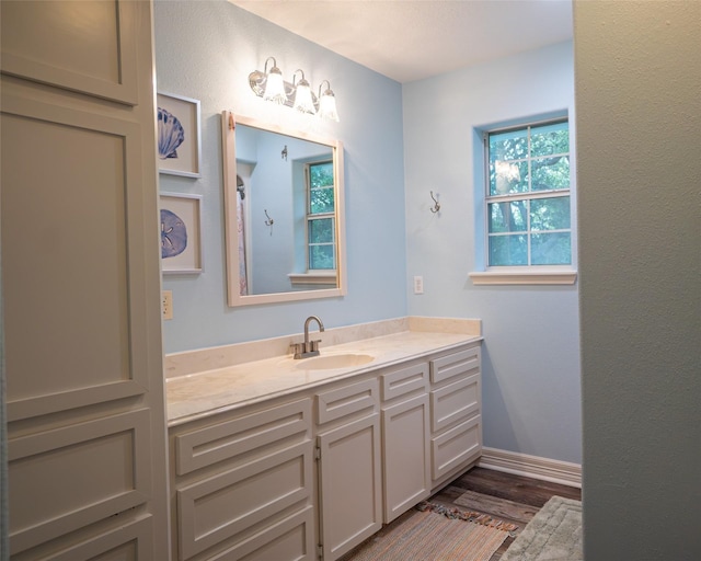 bathroom featuring vanity and wood-type flooring