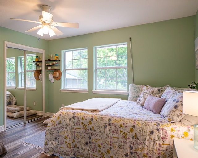 bedroom featuring a closet, ceiling fan, and hardwood / wood-style flooring