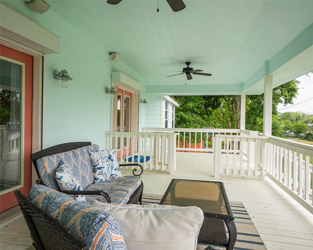 deck featuring an outdoor living space and ceiling fan