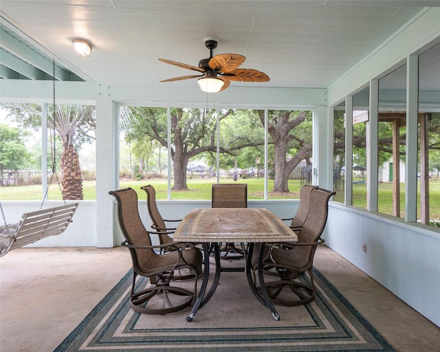 sunroom / solarium with ceiling fan and a healthy amount of sunlight