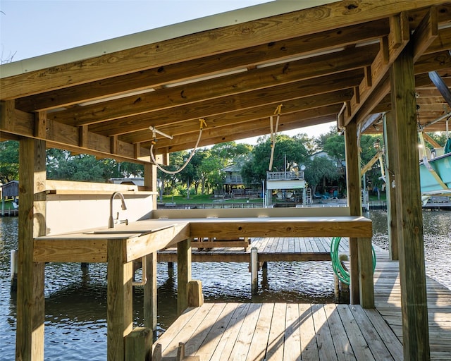 dock area featuring a water view