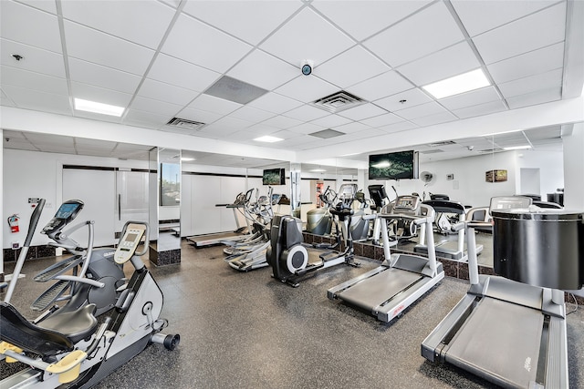 workout area with a paneled ceiling