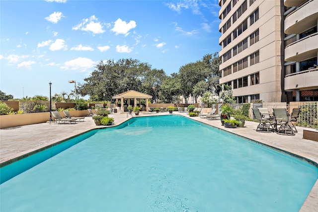 view of pool featuring a patio area