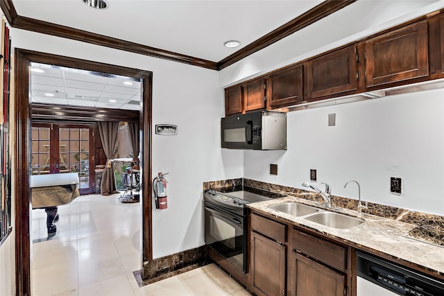 kitchen with light tile flooring, black appliances, ornamental molding, sink, and dark brown cabinetry