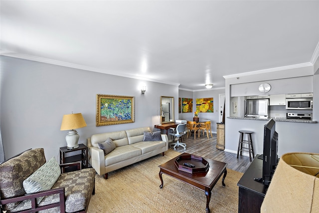 living room with hardwood / wood-style flooring and ornamental molding