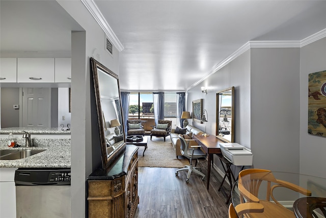 kitchen featuring white cabinets, hardwood / wood-style floors, sink, and dishwasher