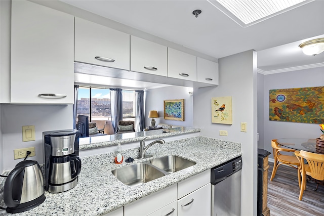 kitchen with white cabinets, light stone countertops, sink, light hardwood / wood-style floors, and dishwasher