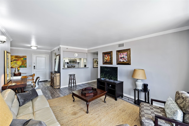 living room with crown molding and dark hardwood / wood-style floors