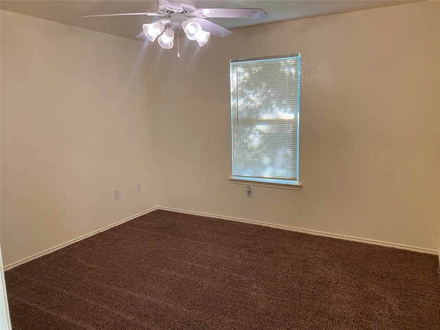 spare room with ceiling fan and carpet flooring