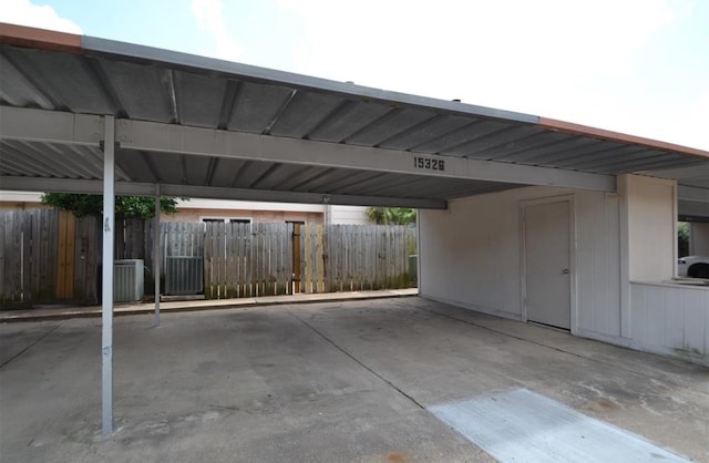 view of parking / parking lot featuring a carport