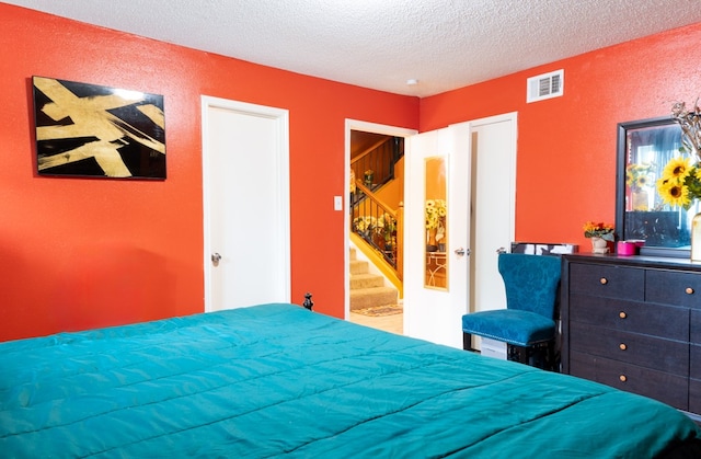 bedroom featuring a textured ceiling