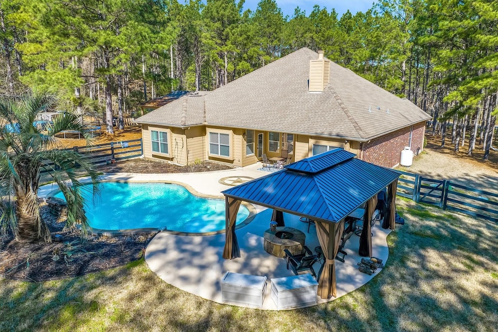 view of pool with a yard and a patio