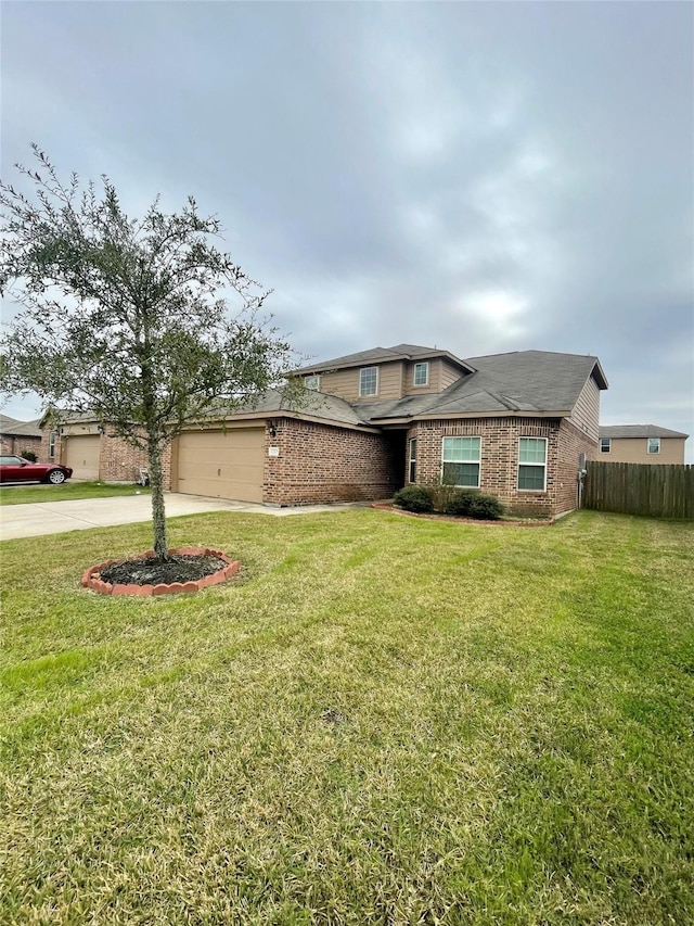 view of front of house featuring a garage and a front lawn