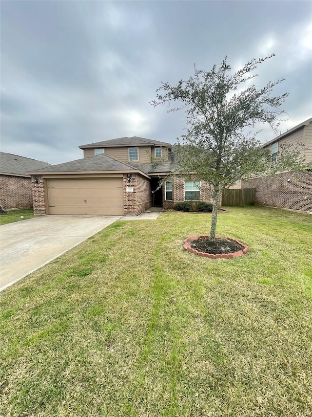 view of front of home featuring a garage and a front lawn