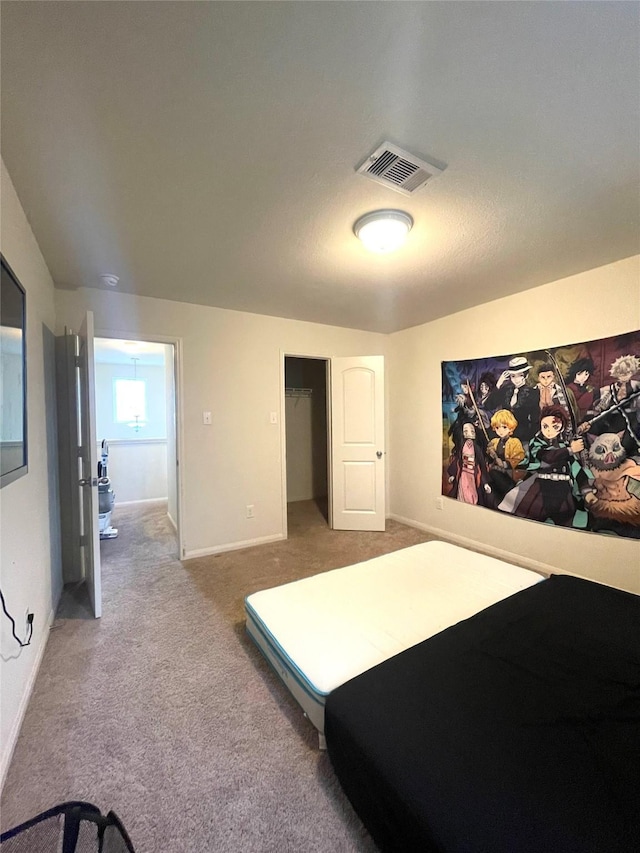 bedroom with carpet and a closet