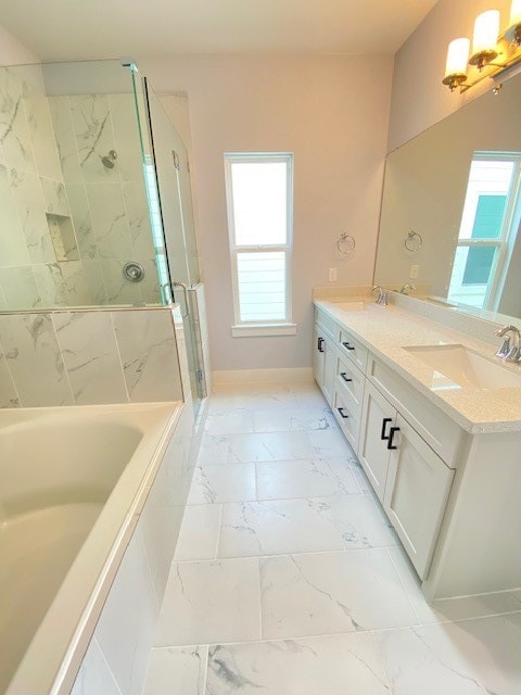 bathroom featuring a wealth of natural light, vanity, and independent shower and bath