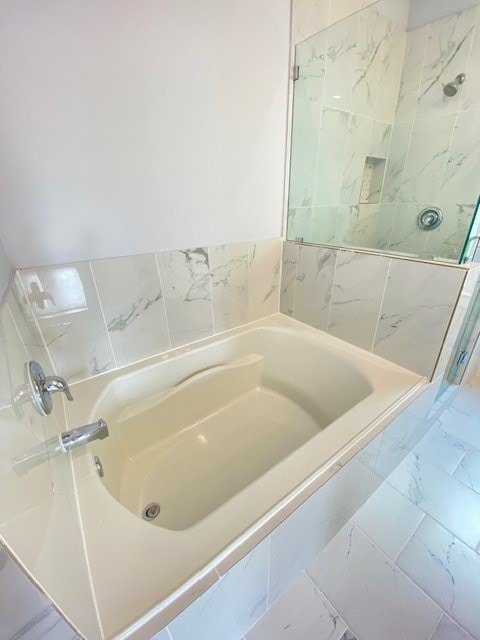 bathroom with independent shower and bath