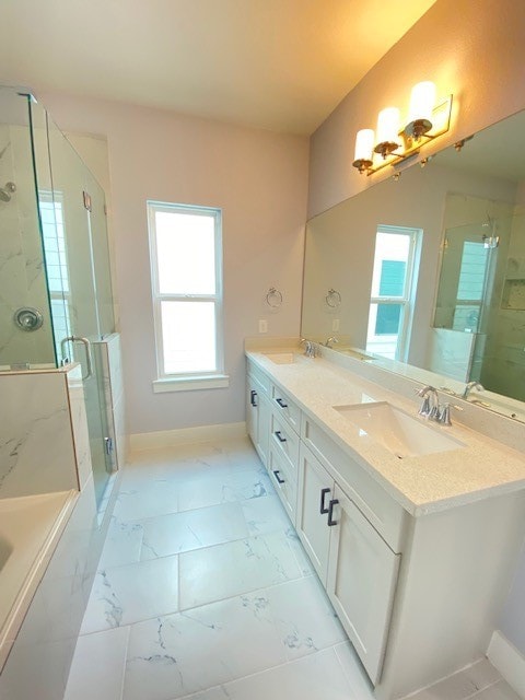 bathroom featuring vanity and shower with separate bathtub