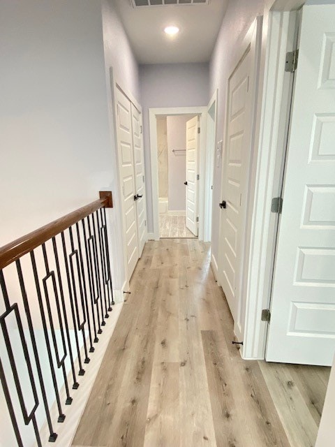 hallway with light wood-type flooring