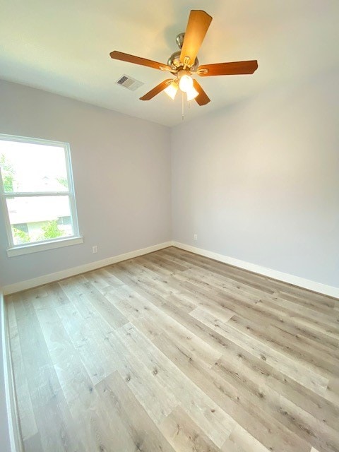 unfurnished room with light hardwood / wood-style flooring