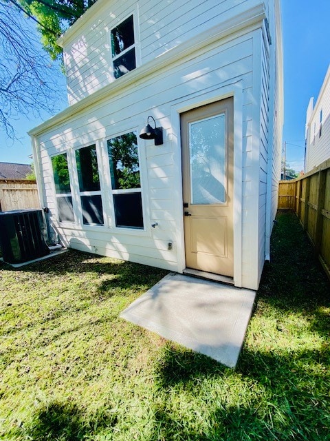 property entrance with a yard