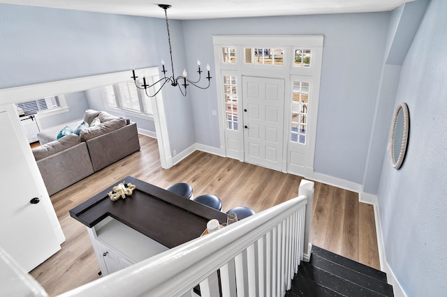 foyer featuring a notable chandelier and light wood-type flooring