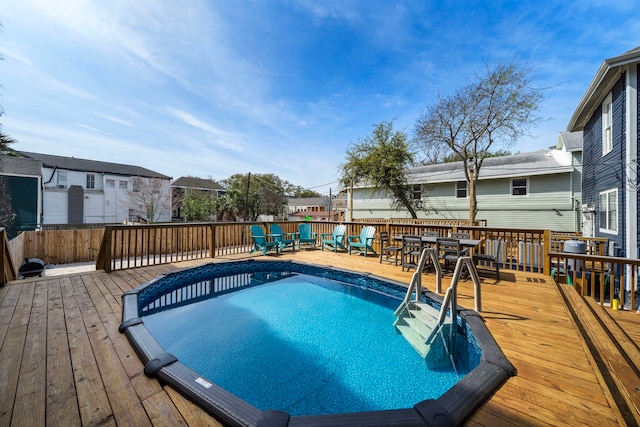 view of swimming pool featuring a deck