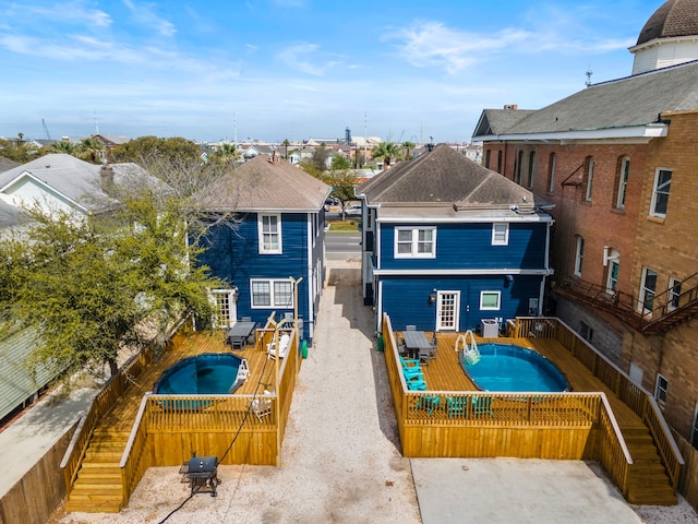 exterior space featuring a patio area and a swimming pool side deck