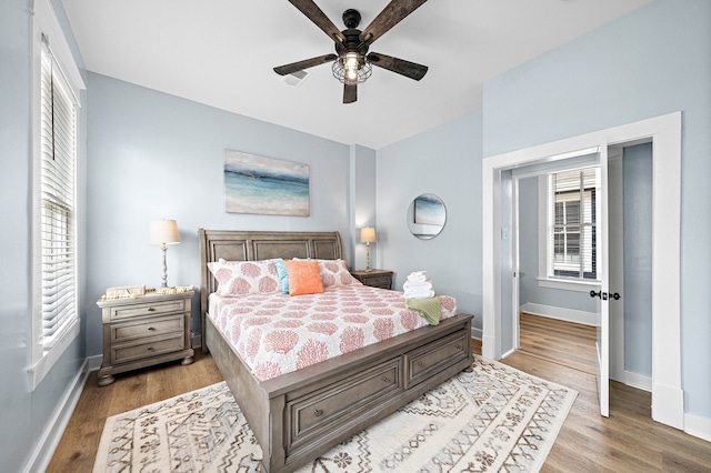 bedroom featuring ceiling fan and light wood-type flooring