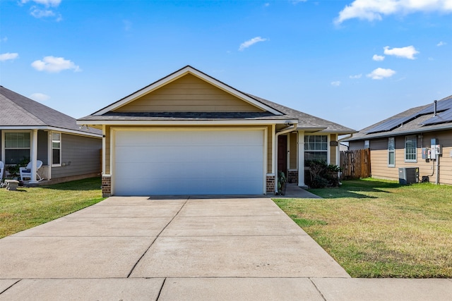 ranch-style home featuring a front lawn, cooling unit, and a garage