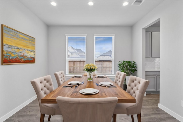 dining room with dark hardwood / wood-style floors