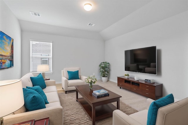 living room with light colored carpet and lofted ceiling