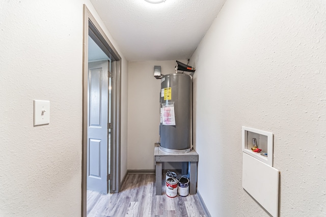 utility room featuring water heater