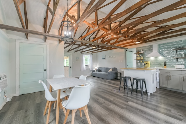 dining area with a chandelier, dark wood-type flooring, and vaulted ceiling with beams