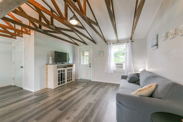 living room featuring vaulted ceiling with beams and dark hardwood / wood-style flooring