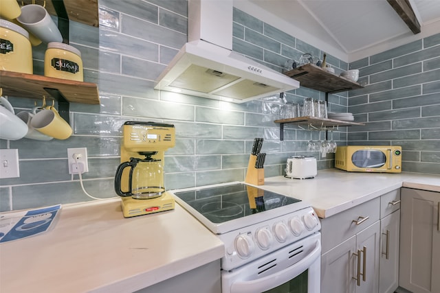 kitchen featuring white appliances, backsplash, and wall chimney exhaust hood